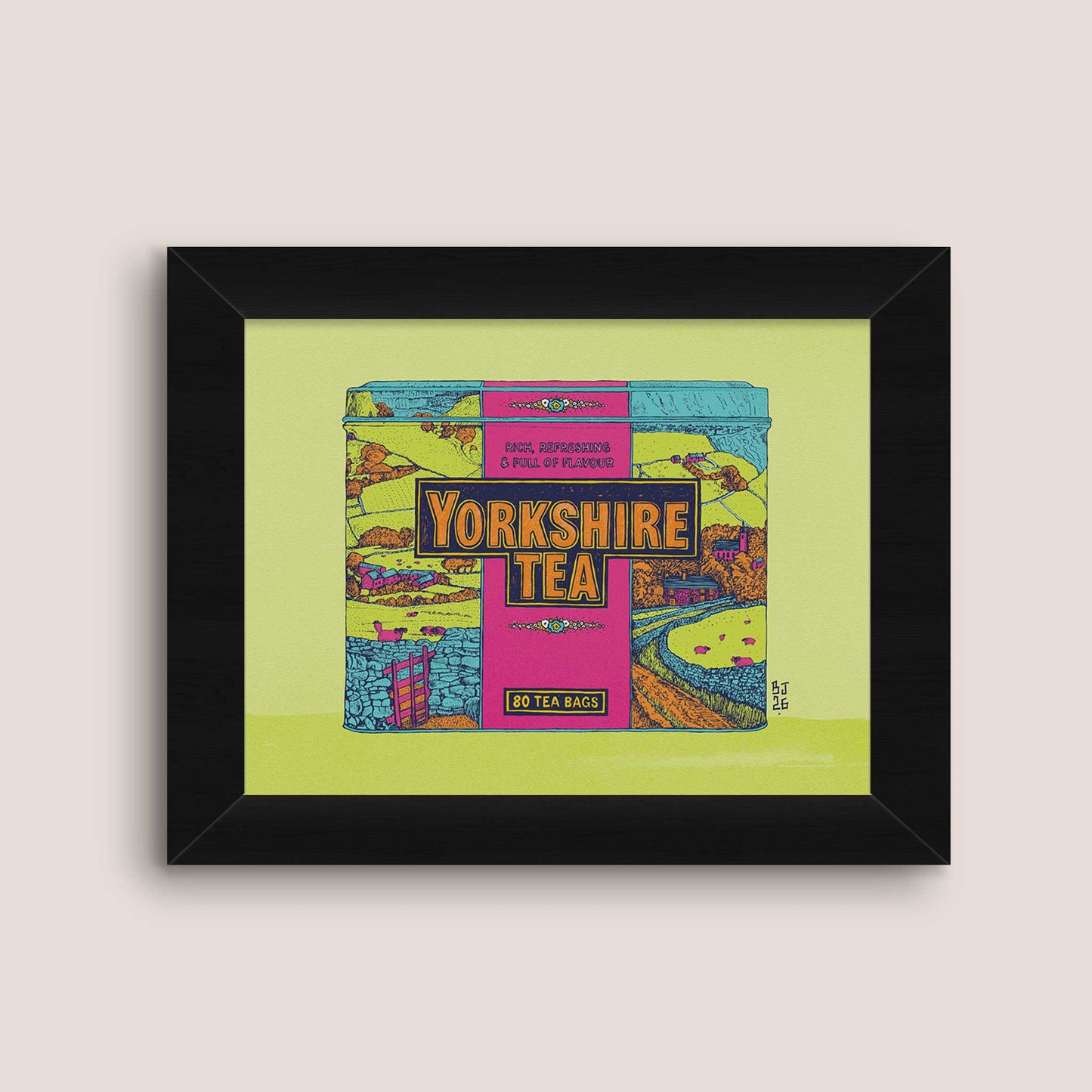 Framed art print featuring a colorful illustration of a Yorkshire Tea box, displayed on a light beige background.