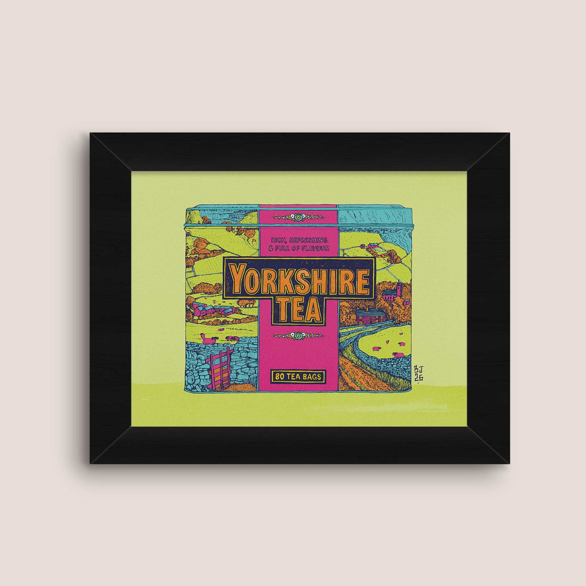Framed art print featuring a colorful illustration of a Yorkshire Tea box, displayed on a light beige background.
