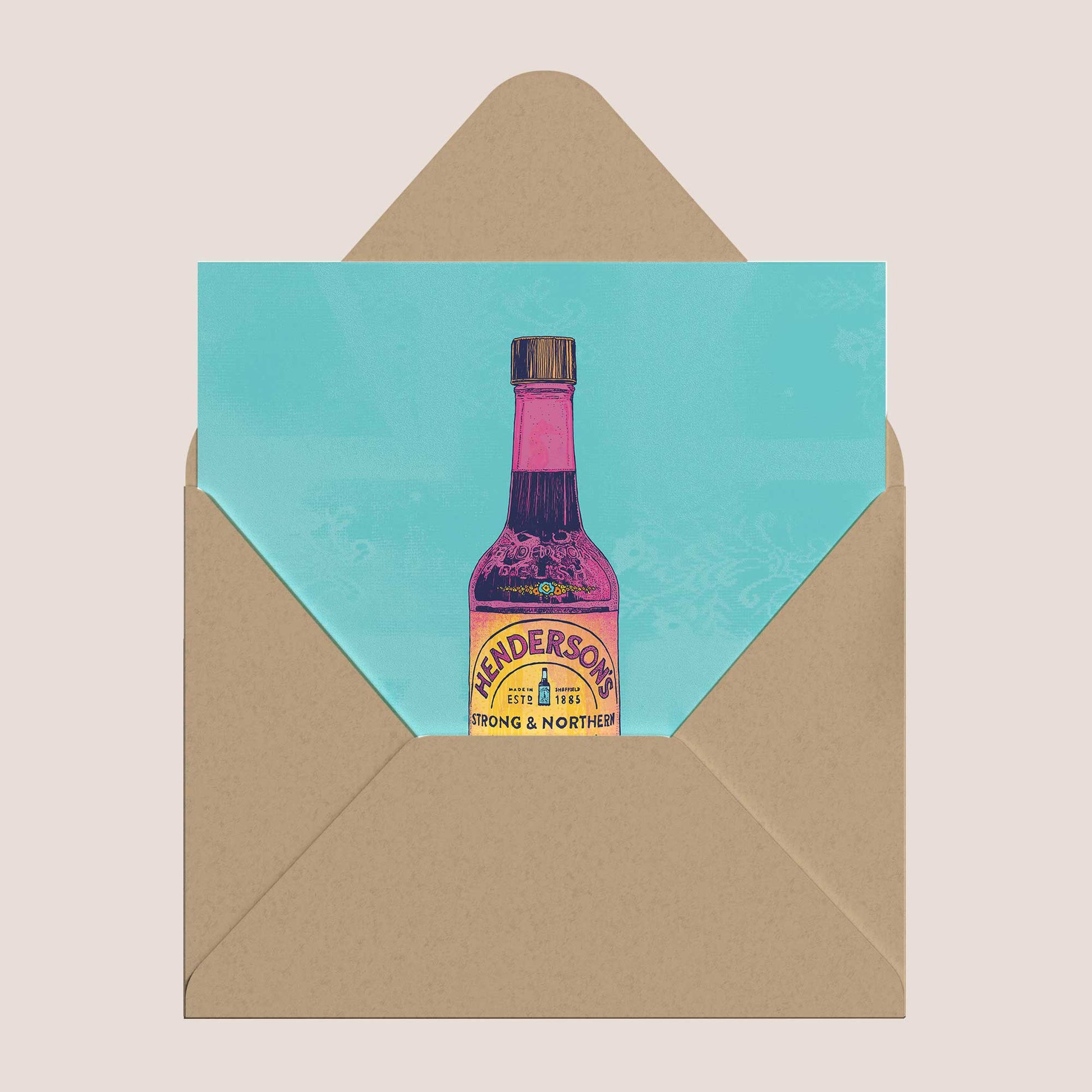 Card with Anderson's bottle design on a turquoise background, inside a brown envelope.