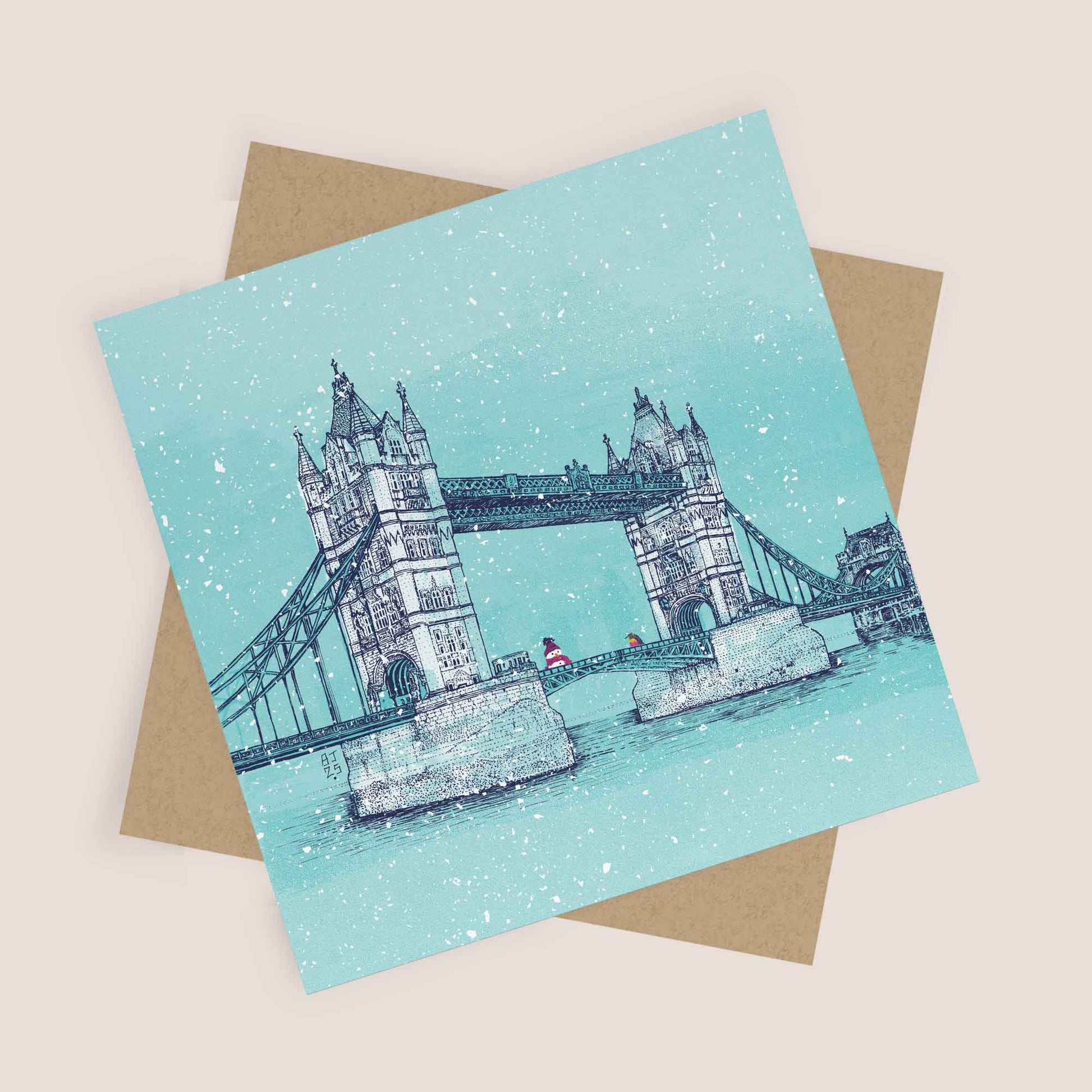 Flatlay of Tower Bridge winter card with matching envelope