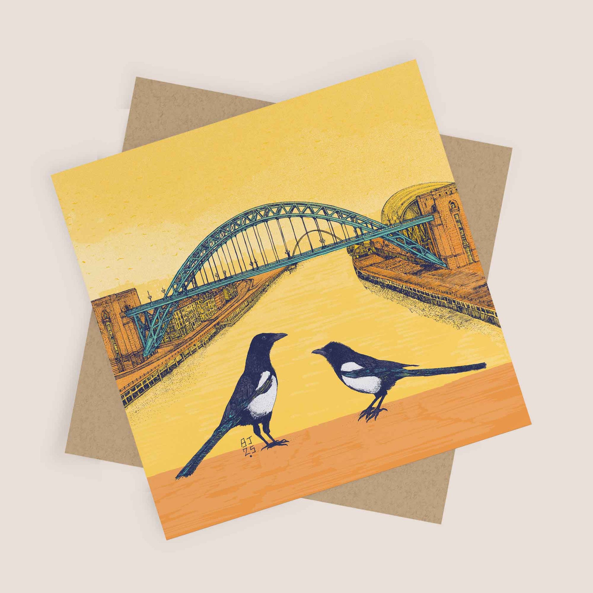 Square Newcastle Tyne Bridge card with two magpies and kraft envelope.