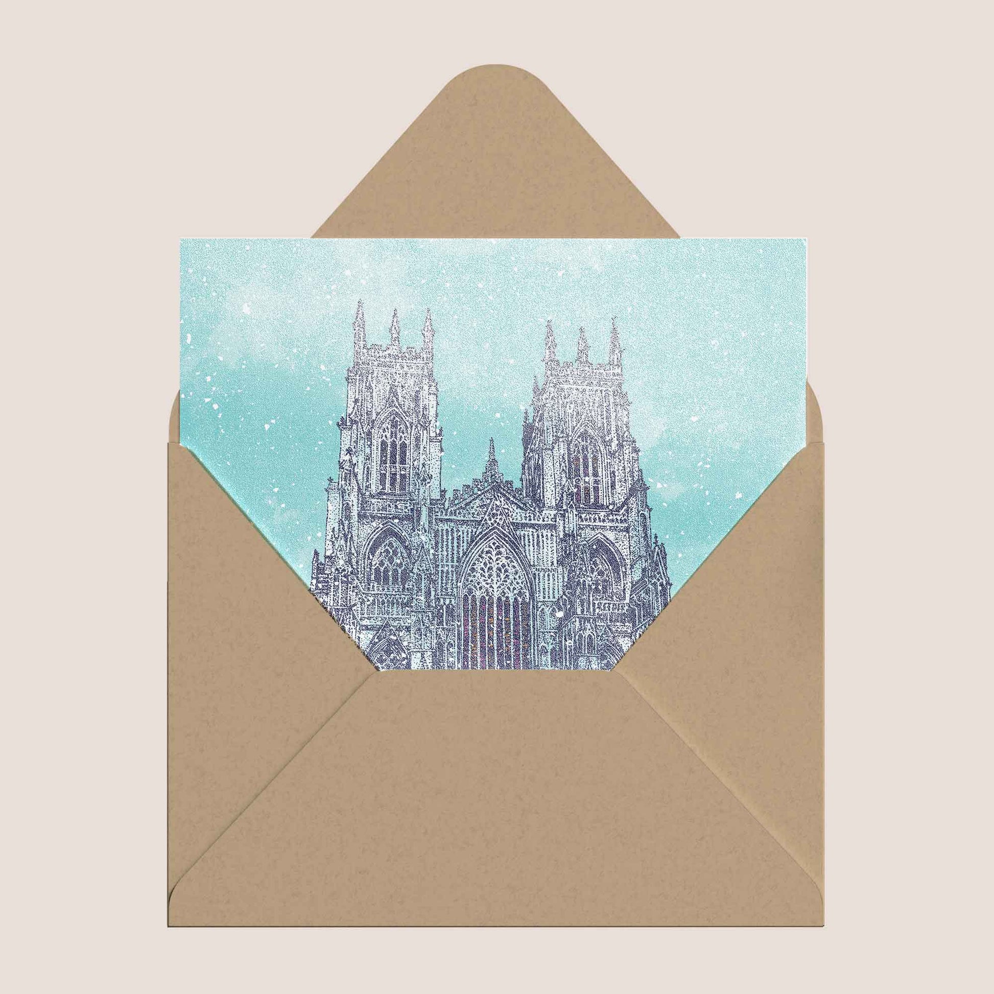 Illustrated Christmas card featuring York Minster in a snowy winter scene inside a kraft envelope